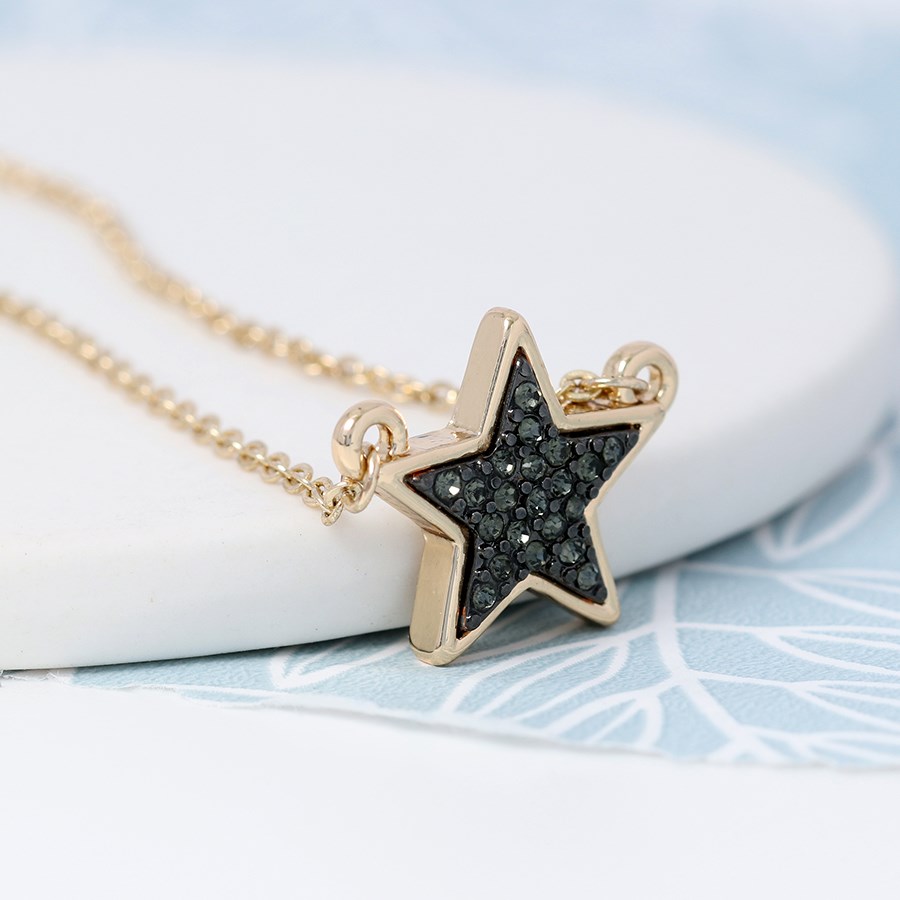 Golden plated star necklace with black sparkle centre